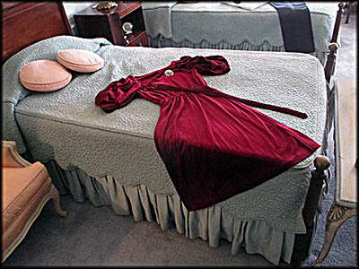 Cooke-Dorn House On the bed in the master bedroom is a dress once worn by Estelle Dorn.
