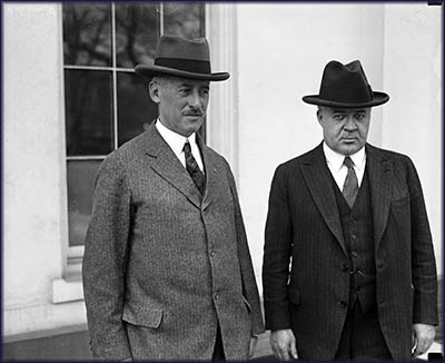 Henry Leland (left) and President Calvin Coolidge (right).