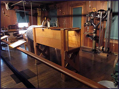 This is a replica of the workshop at at Carollin Historical Park in Dayton, Ohio. It is here where the Wrights designed and built parts of their ariplanes. In the foreground is the wind tunnel.