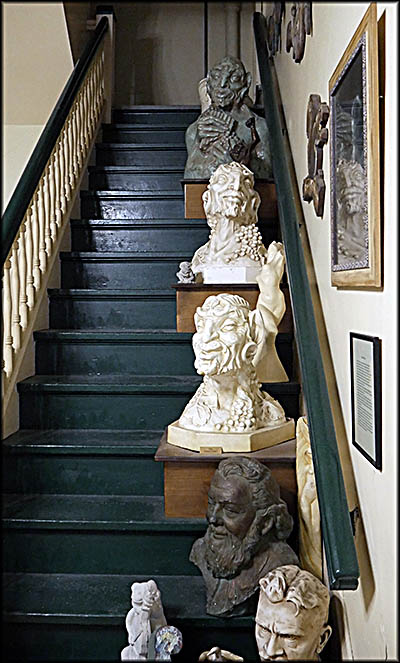 Scuptures by Richard Sheldon, an artist born in Philadelphia in 1900 who spent the much of his life living in Bedford, where he died. These stairs go up to balcony, which the author didn't visit.